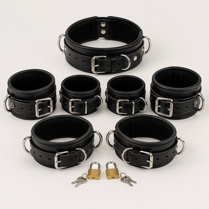 7 piece leather restraint set with padded collar, wrist cuffs, ankle cuffs and thigh cuffs arranged with padlocks and keys"