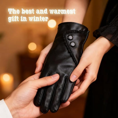 Black leather glove being held with a warm, blurred background