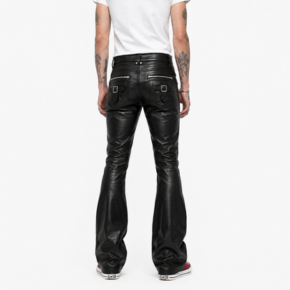 Back view of black leather pants showing buckle strap pocket detail and bootcut flare