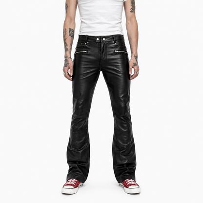 Men's black leather bootcut trousers with zip pockets, front view on model with white sneakers