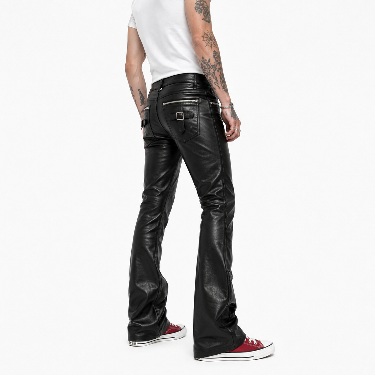 Side profile view of black leather bootcut trousers showing flared silhouette