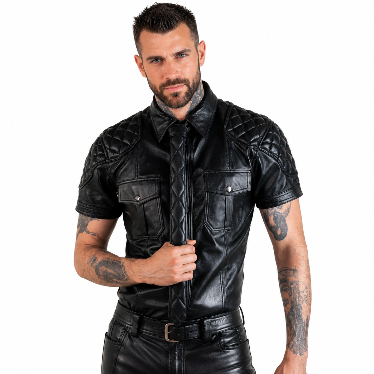 Man wearing black quilted leather uniform shirt with matching leather tie on white background