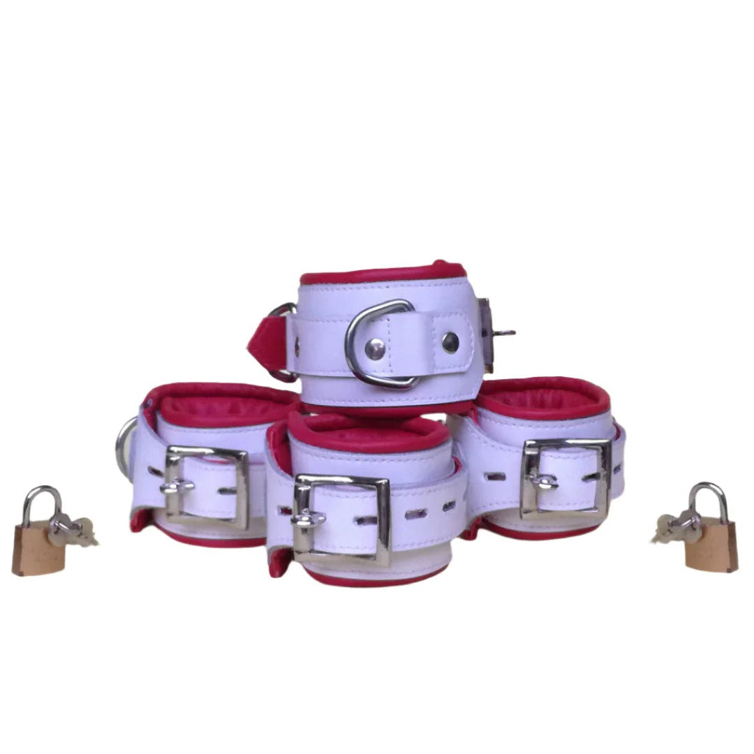 Shop Basix Dip Wear white padded wrist and ankle cuffs with red lining, buckles, D-rings, and padlocks