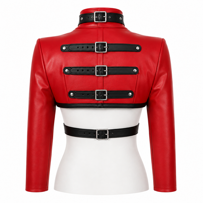 Back view of red cropped harness jacket showing triple black buckle straps and waist strap