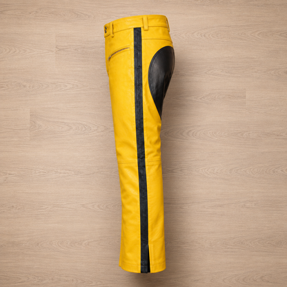 Close-up of black side stripe on yellow leather pants leg